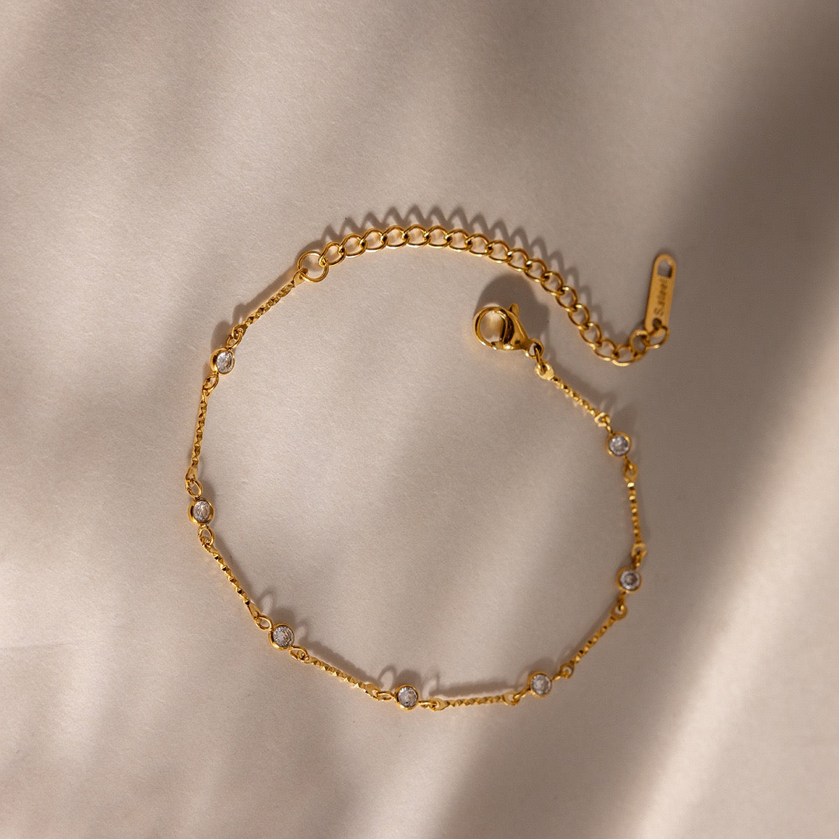 Close-up of zircon details on a stainless steel bracelet