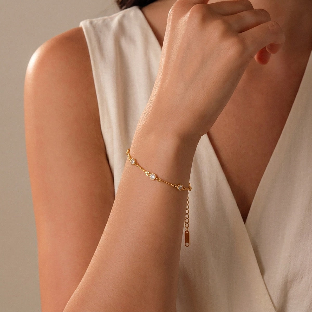 Woman wearing a delicate gold zircon bracelet