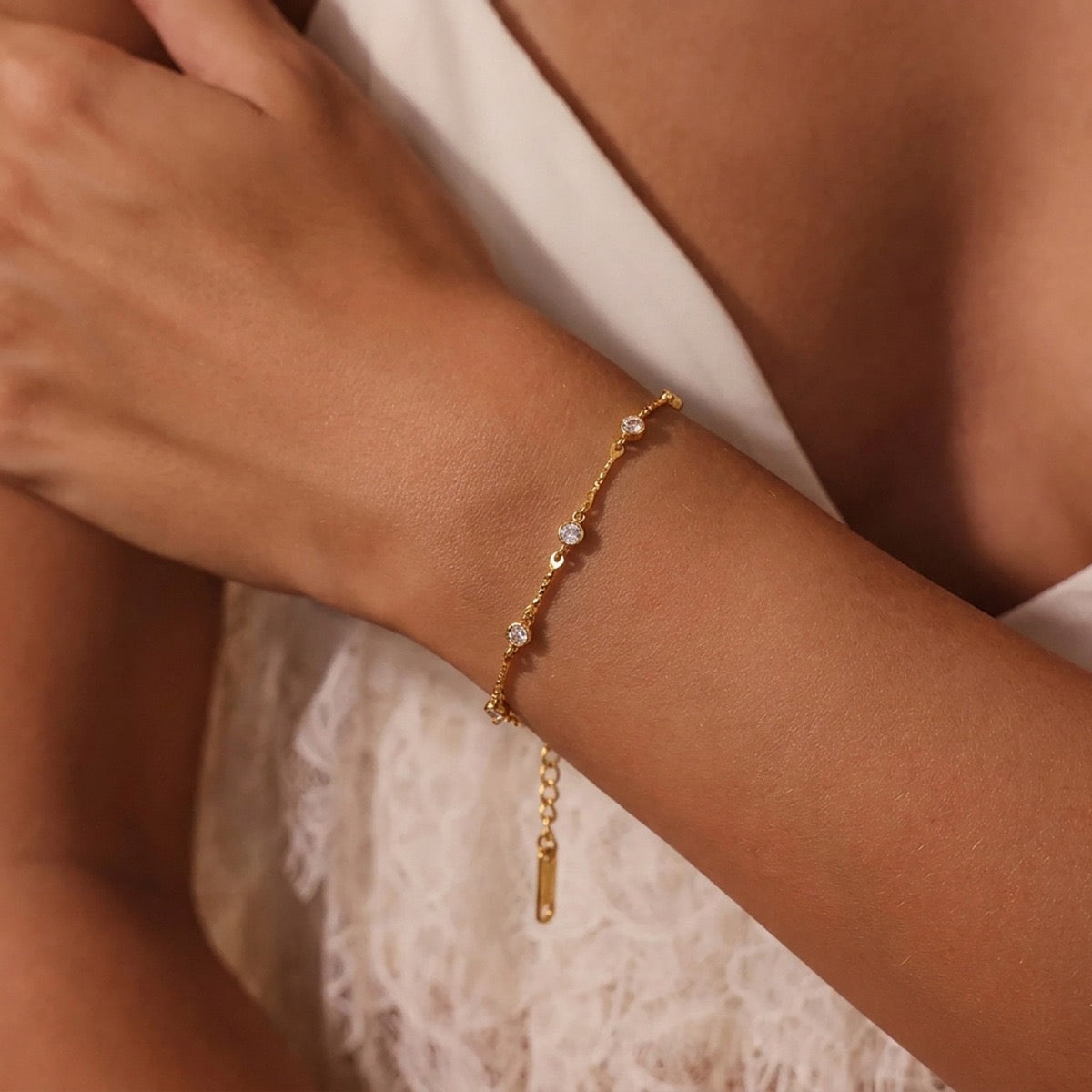 Woman wearing a delicate gold zircon bracelet