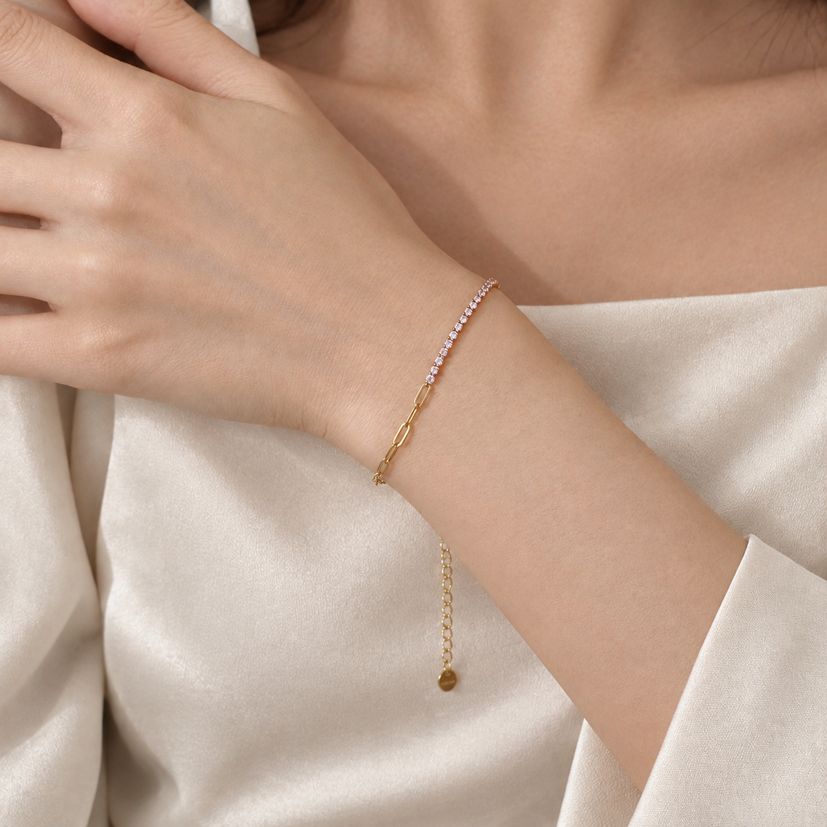 Woman wearing a delicate gold zircon stainless steel bracelet