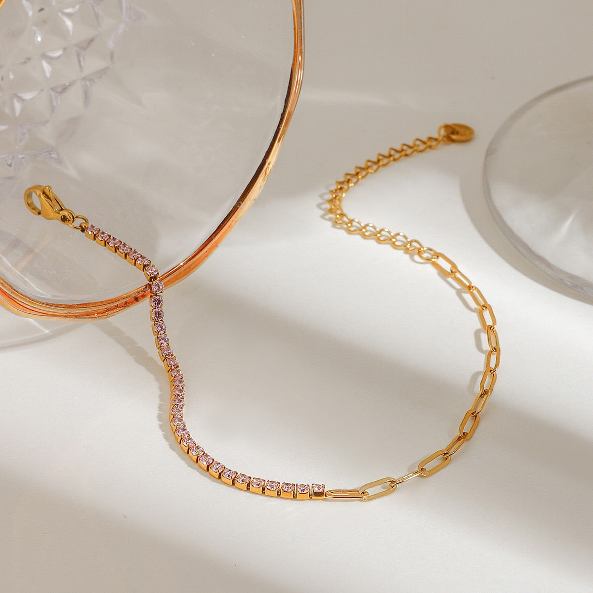 Close-up of zircon details on a gold stainless steel bracelet