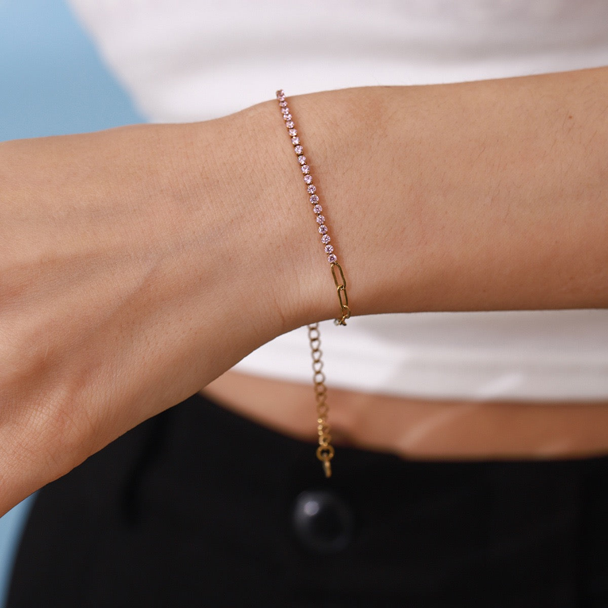 Woman wearing a delicate gold zircon stainless steel bracelet